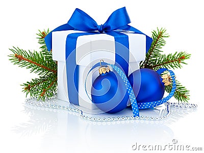 White box tied blue ribbon bow, pine tree branch and christmas balls Stock Photo