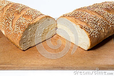 White bread with sesame seeds on kitchen board Stock Photo