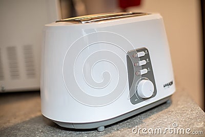 White bread toaster sitting on the kitchen counter. with blured background Stock Photo