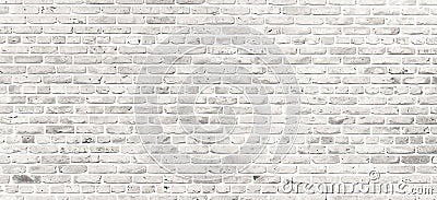 White brick wall. Simple grungy white brick wall with light gray shades pattern surface texture background in wide panorama format Stock Photo