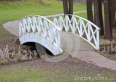 White bridge and path in park Stock Photo