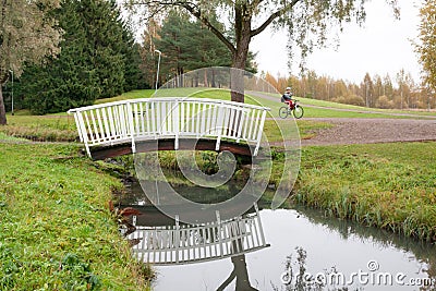 White bridge and pond in the city park Haanoja. Kouvola, Finland Editorial Stock Photo