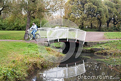 White bridge and pond in the city park Haanoja. Kouvola, Finland Editorial Stock Photo