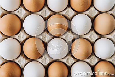 white and brown eggs laying in egg carton, full Stock Photo