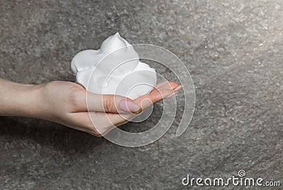 White bubbled foam in woman`s nice hand Stock Photo