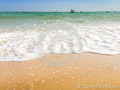 White bubbles created on the beach by ocean waves on seashore Foam bubbles abstract white background. Detergent white foam with s Stock Photo