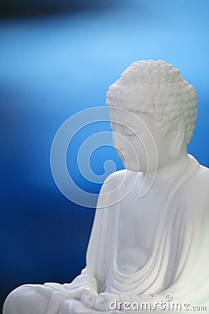 White Buddha on blue 02 Stock Photo