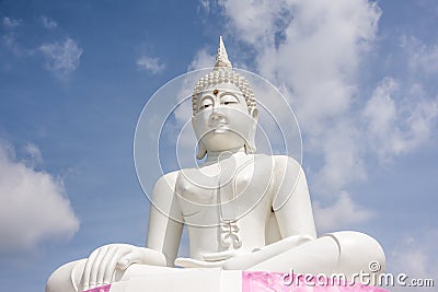 White Buddha and sky Located near Pa Sak Jolasid Dam Thailand. Stock Photo