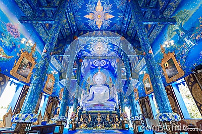 The white buddha statue inside the Hall in Blue temple Wat Rong Suea Ten Editorial Stock Photo