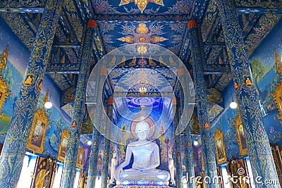 The white buddha statue inside the Hall in Blue temple Wat Rong Suea Ten Stock Photo