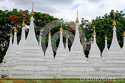 White buddhist pagodas with trees background, Myanmar Stock Photo