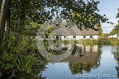 white building at Esrum Abbey reflecting in the pond Editorial Stock Photo