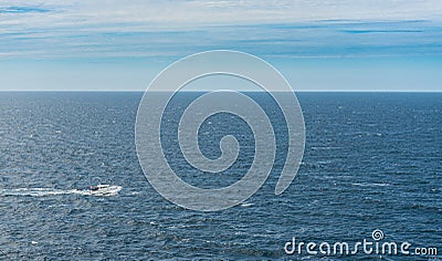 A white cabin cruiser crossing open seas Stock Photo