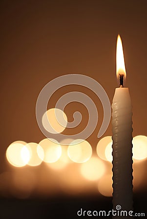 White candle on dark background Stock Photo