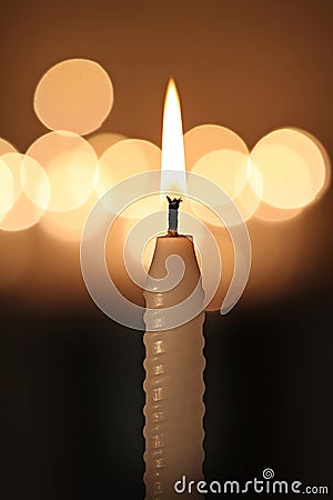 White candle on dark background Stock Photo