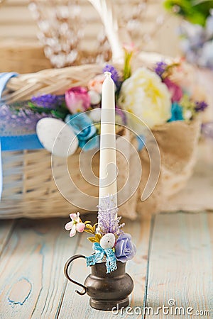 White candle decorated with flowers. Easter concept Stock Photo