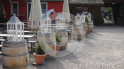 White candle holder on top of Wooden barrels Editorial Stock Photo