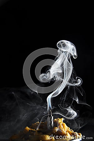 White candle smoke at dark background Stock Photo
