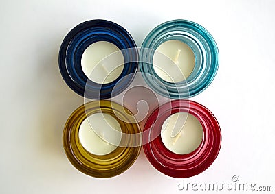 White candles in glass candlesticks Stock Photo