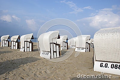 White canopied beach chairs at Baltic Sea Stock Photo