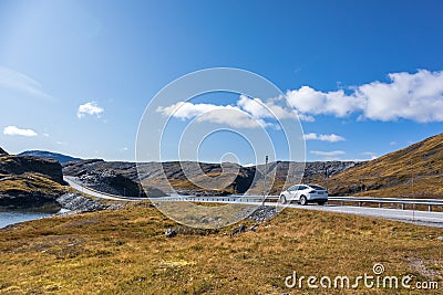 White car drive Norway highway mountain sunny day Editorial Stock Photo