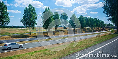 White car driving over a motorway Stock Photo