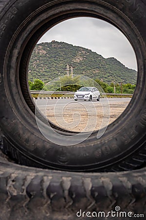 white car passing at national highways at morning from unique perceptive Editorial Stock Photo