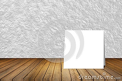 White card put on wooden desk or wooden floor on blurred abstract white wall texture background.use for present or mock up product Stock Photo