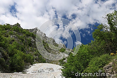 White Carrara marble quarry in the Apuan Alps. A mountain peak n Editorial Stock Photo