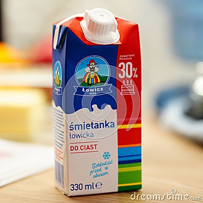 White carton of milk on a wooden table Editorial Stock Photo