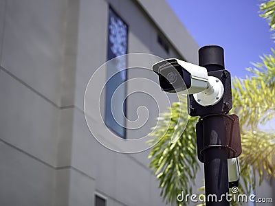 White CCTV cameras on the black pole Stock Photo