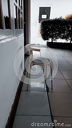 White chair in front of the window Stock Photo