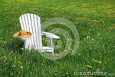White chair with straw hat Stock Photo