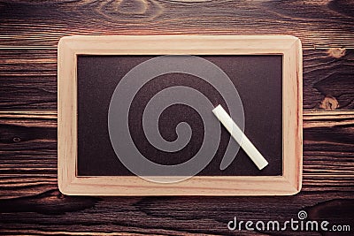 White chalk abstract on vintage slate blackboard on wooden background Stock Photo