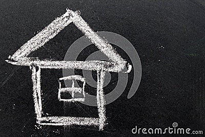 White chalk drawing as house shape on black board background Stock Photo