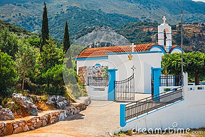 White chapel and mountains, Crete Island, Greece Editorial Stock Photo