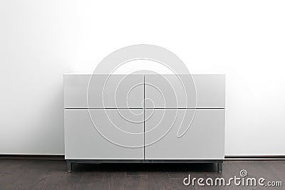 White chest of drawers in bright minimalism interior Stock Photo