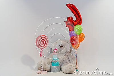 White children`s photozone with huge soft bear and balloons Stock Photo