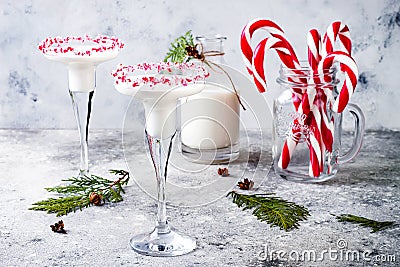 White chocolate peppermint martini with candy cane rim. Christmas holiday party drink Stock Photo