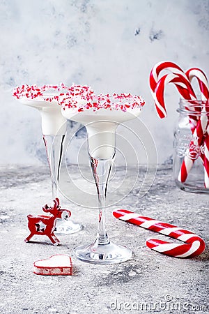 White chocolate peppermint martini with candy cane rim. Christmas holiday party drink Stock Photo