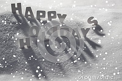 White Christmas Card, Text Happy Holidays On Snow, Snowflakes Stock Photo