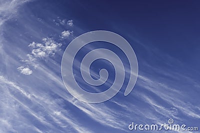 White cirrus clouds expanding by wind moving like waves to cover navy blue sky background in tropical summer, Nature weather, copy Stock Photo