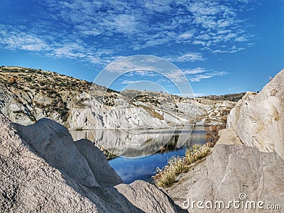White cliffs reflections at the Blue Lake at St Bathans in New Zealand Stock Photo