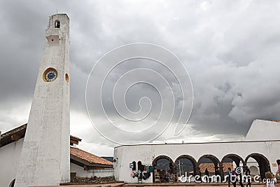 White clock tower with colonial arc structure at Guatavita colombian town Editorial Stock Photo