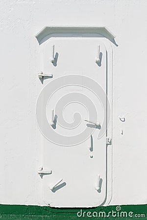 White closed iron door on the ship Stock Photo