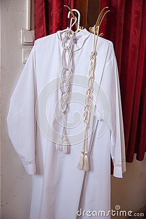 Clothes of christian priest on a hanger Stock Photo