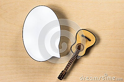 White cloud for text and and toy guitar on wooden background Stock Photo
