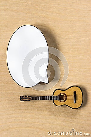 White cloud for text and and toy guitar on wooden background Stock Photo