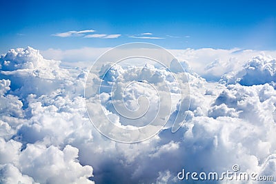 White clouds on blue sky background close up, cumulus clouds high in azure skies, beautiful aerial cloudscape view from above Stock Photo