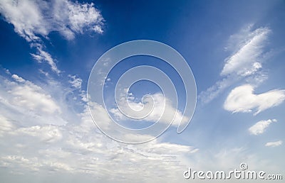 White clouds in deep blue summer sky Stock Photo